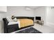 Basement bedroom with a daybed and flat-screen TV at 3955 S Uinta St, Denver, CO 80237