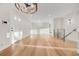 Hallway with hardwood floors and staircase at 3955 S Uinta St, Denver, CO 80237