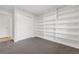 Bedroom with built-in shelving and grey carpeting at 3955 S Uinta St, Denver, CO 80237