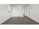 Bright bedroom with double door closet and grey carpet at 3955 S Uinta St, Denver, CO 80237