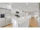 Spacious kitchen with island, stainless steel appliances, and hardwood floors at 3955 S Uinta St, Denver, CO 80237