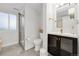 Modern basement bathroom with a shower, toilet and vanity at 3955 S Uinta St, Denver, CO 80237