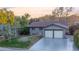 Two-car garage and a well-maintained lawn at 3955 S Uinta St, Denver, CO 80237