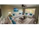 Living room featuring a sofa, chairs, and coffee table at 13031 Dexter St, Thornton, CO 80241