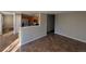 Open living room with tile floors and kitchen views at 13031 Dexter St, Thornton, CO 80241