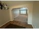 Open living room with tiled floor and view into dining room at 13031 Dexter St, Thornton, CO 80241