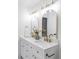 Elegant bathroom with double vanity and gold fixtures at 10182 Stoneridge Ter, Parker, CO 80134