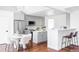 Modern kitchen with gray cabinets and a breakfast bar at 10182 Stoneridge Ter, Parker, CO 80134