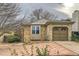 Brick ranch home with attached garage and a paved driveway at 17896 E Colgate Pl, Aurora, CO 80013