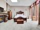 Grand Primary suite boasting a fireplace and French doors leading to a patio at 3611-3615 Osage St, Denver, CO 80211