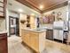 Island kitchen with granite and wood cabinets at 3611-3615 Osage St, Denver, CO 80211