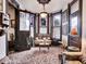 Bright sunroom with stained glass windows and seating at 3611-3615 Osage St, Denver, CO 80211