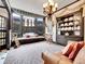 Living room with bay window, built-in window seat, and dark wood cabinets at 3611-3615 Osage St, Denver, CO 80211