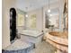 Bathroom with a large soaking tub, unique stone sink and a shower at 3611-3615 Osage St, Denver, CO 80211