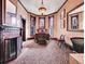 Primary bedroom with fireplace and bay windows at 3611-3615 Osage St, Denver, CO 80211