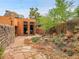 Landscaped backyard patio and walkway with access to a guest house at 3611-3615 Osage St, Denver, CO 80211