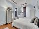 Bright bedroom with light walls and wood floors at 3611-3615 Osage St, Denver, CO 80211