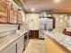 View of stainless steel kitchen with granite island and ample storage at 3611-3615 Osage St, Denver, CO 80211