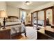 Spacious bedroom with antique furniture and large windows at 3611-3615 Osage St, Denver, CO 80211