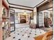 Elegant entryway with tiled floor, fireplace, and views into adjoining rooms at 3611-3615 Osage St, Denver, CO 80211
