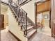 Grand staircase with ornate railing leading to upper level at 3611-3615 Osage St, Denver, CO 80211