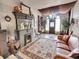 Living room features a fireplace and seating area with a view at 3611-3615 Osage St, Denver, CO 80211
