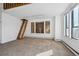 Living room with built-in shelving and loft access at 9020 Clay St, Denver, CO 80260