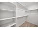 Large walk-in closet with double hanging rods and shelving at 45016 Sunflower Ln, Bennett, CO 80102