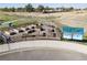 Community garden with raised beds and a colorful art installation at 45016 Sunflower Ln, Bennett, CO 80102