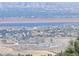 Panoramic view of a lake and distant city at 6183 Buffalo Run, Littleton, CO 80125