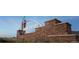 Sky Ranch community entrance with stone wall and modern signage at 738 N Clubview St, Watkins, CO 80137