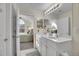 Clean bathroom with double vanity and a view into bedroom at 2481 Santa Fe Dr # C, Longmont, CO 80504