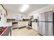 Modern kitchen with stainless steel appliances and white cabinets at 5837 Newcombe Ct, Arvada, CO 80004