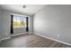 Bright bedroom with a large window and grey walls at 3231 E 103Rd Pl # 308, Thornton, CO 80229