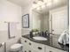 Elegant bathroom with black granite vanity and white subway tiles at 3231 E 103Rd Pl # 308, Thornton, CO 80229