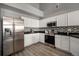 Modern kitchen with stainless steel appliances and granite countertops at 3231 E 103Rd Pl # 308, Thornton, CO 80229