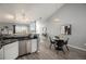 Modern kitchen featuring stainless steel appliances and a breakfast bar at 3231 E 103Rd Pl # 308, Thornton, CO 80229