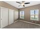 Comfortable bedroom with double door closet and carpet at 59304 E Commanche Way, Strasburg, CO 80136