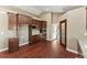 Well-equipped kitchen featuring dark wood cabinets and stainless steel appliances at 59304 E Commanche Way, Strasburg, CO 80136