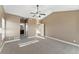 Main bedroom with access to bathroom and ceiling fan at 59304 E Commanche Way, Strasburg, CO 80136