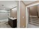 Basement bathroom with shower/tub combo and dark vanity at 59304 E Commanche Way, Strasburg, CO 80136