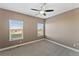 Spacious bedroom with neutral walls and carpet flooring at 59304 E Commanche Way, Strasburg, CO 80136