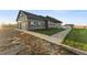 House exterior showcasing a two-car garage and landscaped yard at 59304 E Commanche Way, Strasburg, CO 80136