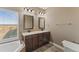 Elegant bathroom with double sinks and granite countertops at 59304 E Commanche Way, Strasburg, CO 80136