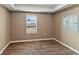 Unfinished basement room with vinyl plank flooring at 59304 E Commanche Way, Strasburg, CO 80136