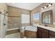 Spa-like bathroom with soaking tub, walk-in shower, and double vanity at 59304 E Commanche Way, Strasburg, CO 80136