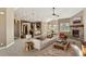 Spacious living room with a fireplace and lots of natural light at 59304 E Commanche Way, Strasburg, CO 80136