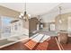 Open dining room with hardwood floors and a chandelier at 59304 E Commanche Way, Strasburg, CO 80136