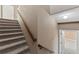 Carpeted staircase leading down to the finished basement at 59304 E Commanche Way, Strasburg, CO 80136