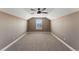 Large bedroom with ceiling fan and window at 59304 E Commanche Way, Strasburg, CO 80136